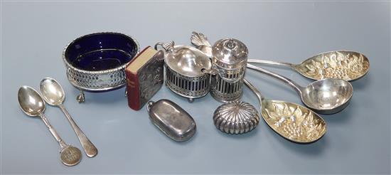 A pair of silver berry spoons and soup spoon, three silver condiments, silver sovereign case and four other items.